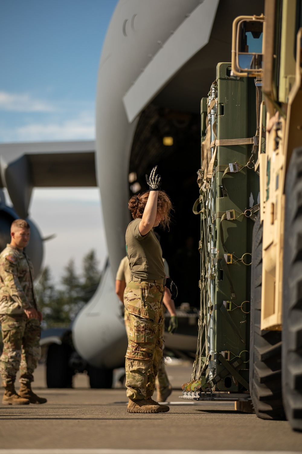 Checked baggage: Washington National Guard soldiers load Black Hawks into a C-17 Globemaster III