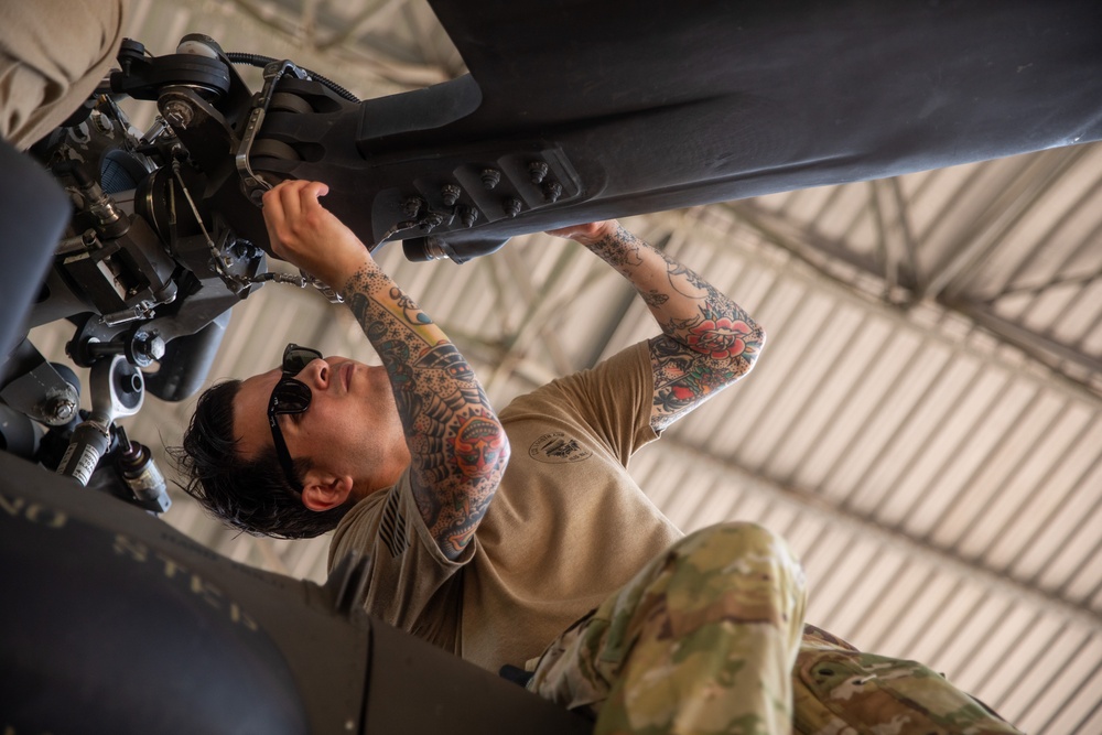 Air Mobility. Some assembly required: Washington National guard soldiers work to prepare Blackhawks for flight.