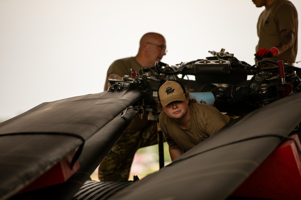 Air Mobility. Some assembly required: Washington National guard soldiers work to prepare Blackhawks for flight.