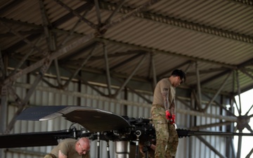 Air Mobility. Some assembly required: Washington National guard soldiers work to prepare Blackhawks for flight.
