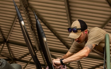 Air Mobility. Some assembly required: Washington National guard soldiers work to prepare Blackhawks for flight.