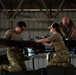 Air Mobility. Some assembly required: Washington National guard soldiers work to prepare Blackhawks for flight.