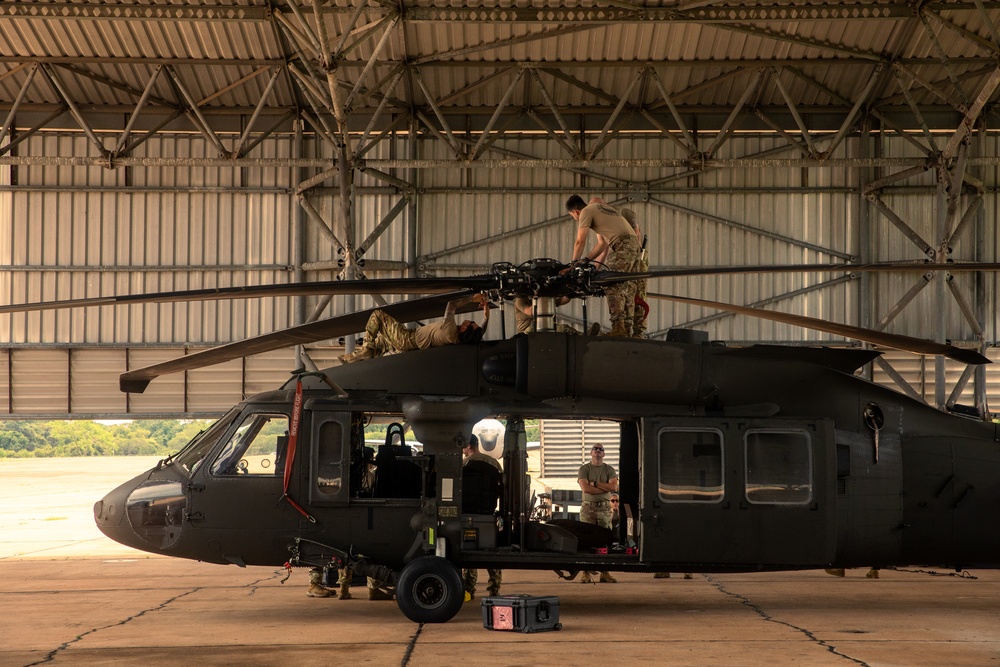 Air Mobility. Some assembly required: Washington National guard soldiers work to prepare Blackhawks for flight.