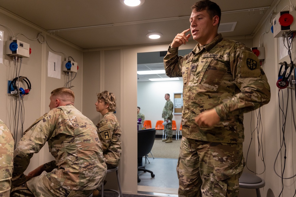 Soldiers Conduct Hearing Exam
