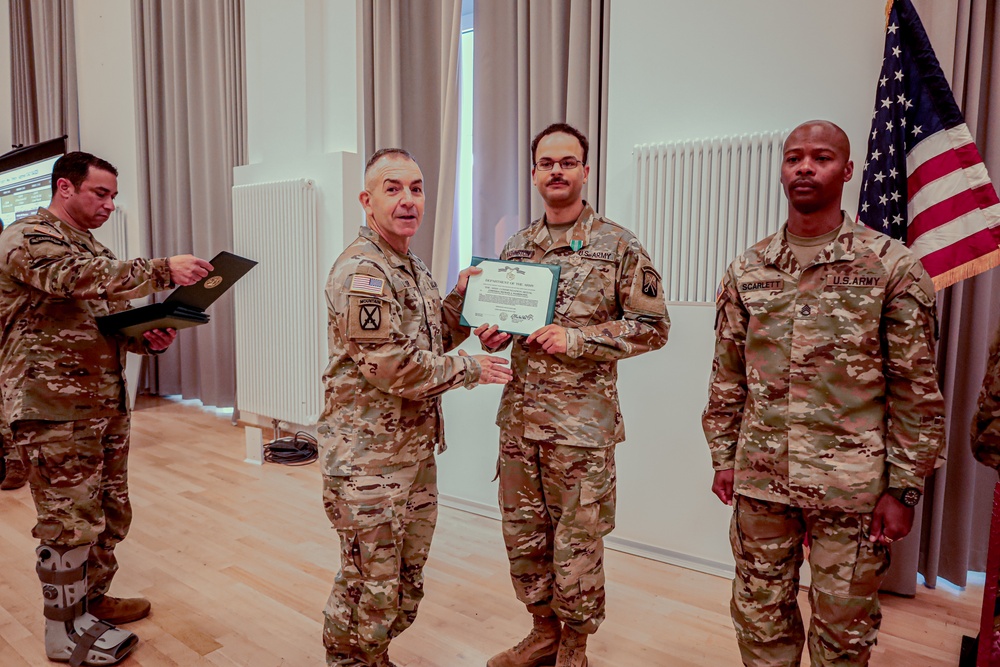21st TSC Commander Presents medals to 16th Sustainment Brigade Soldiers