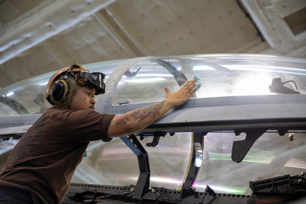VFA-213 Sailor Cleans Aircraft