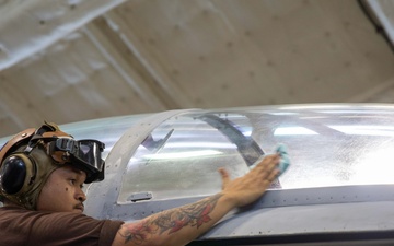 VFA-213 Sailor Cleans Aircraft