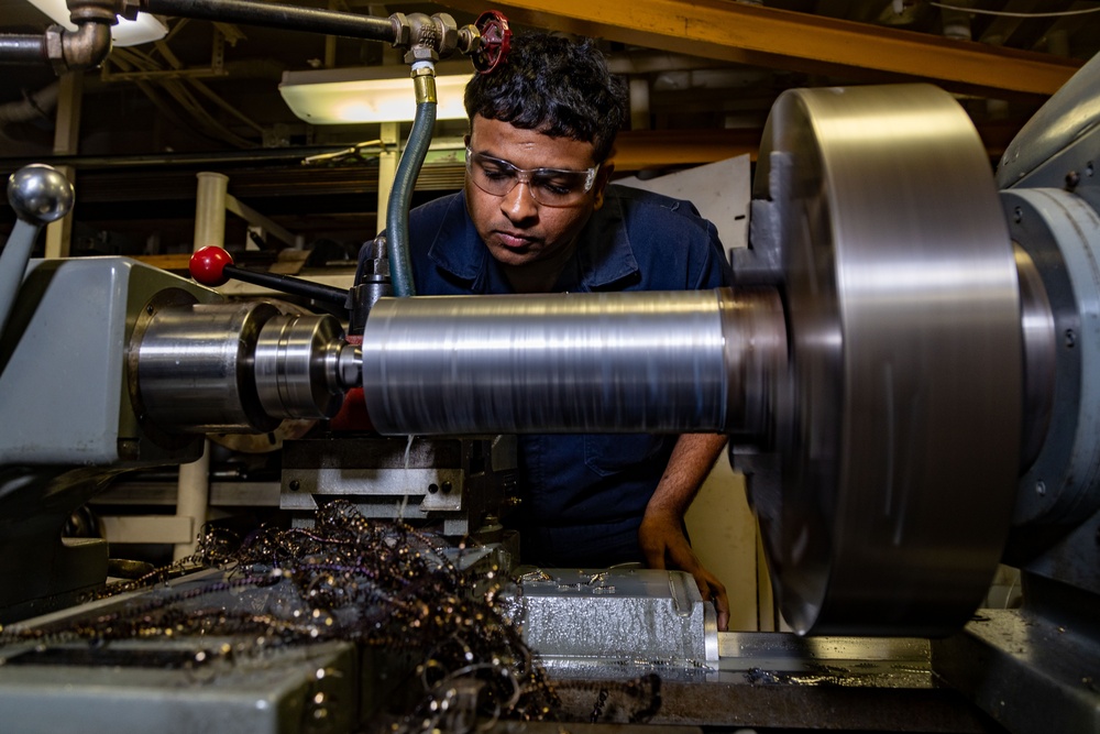 USS Gerald R. Ford (CVN 78) Sailor Operates Lathe