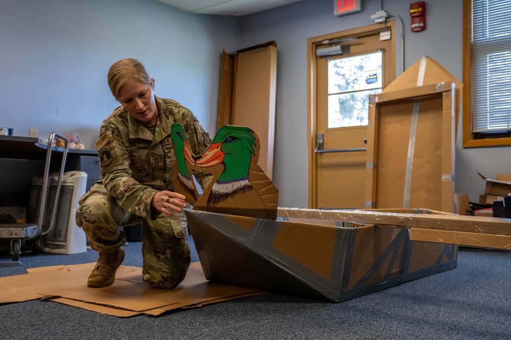 Sink or win: 22nd OSS flights compete in cardboard boat race