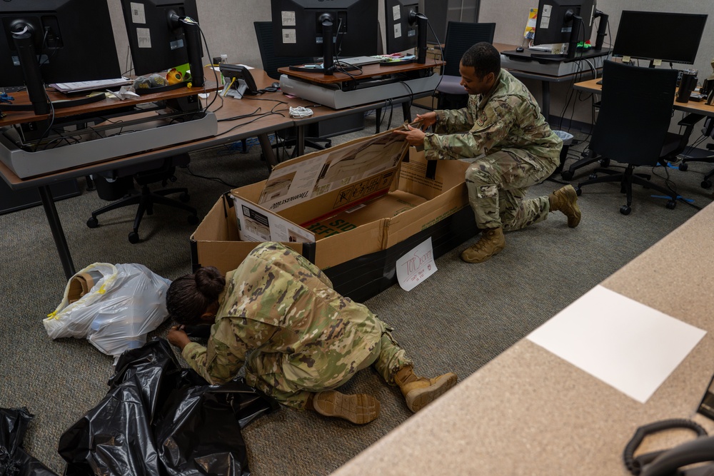 Sink or win: 22nd OSS flights compete in cardboard boat race