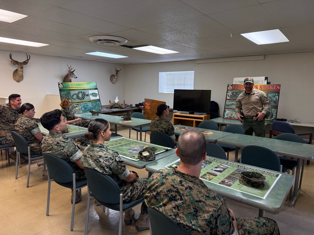 U.S. Navy Sailors participate in snake handlers course