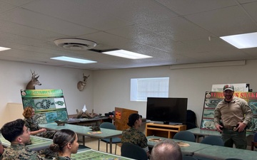U.S. Navy Sailors participate in snake handlers course