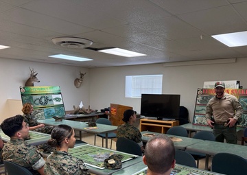 U.S. Navy Sailors participate in snake handlers course