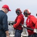 Sailors aboard the USS John Finn conduct a crash and salvage drill in the South China Sea