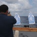 Sailors aboard the USS John Finn conduct a small arms gun shoot in the South China Sea