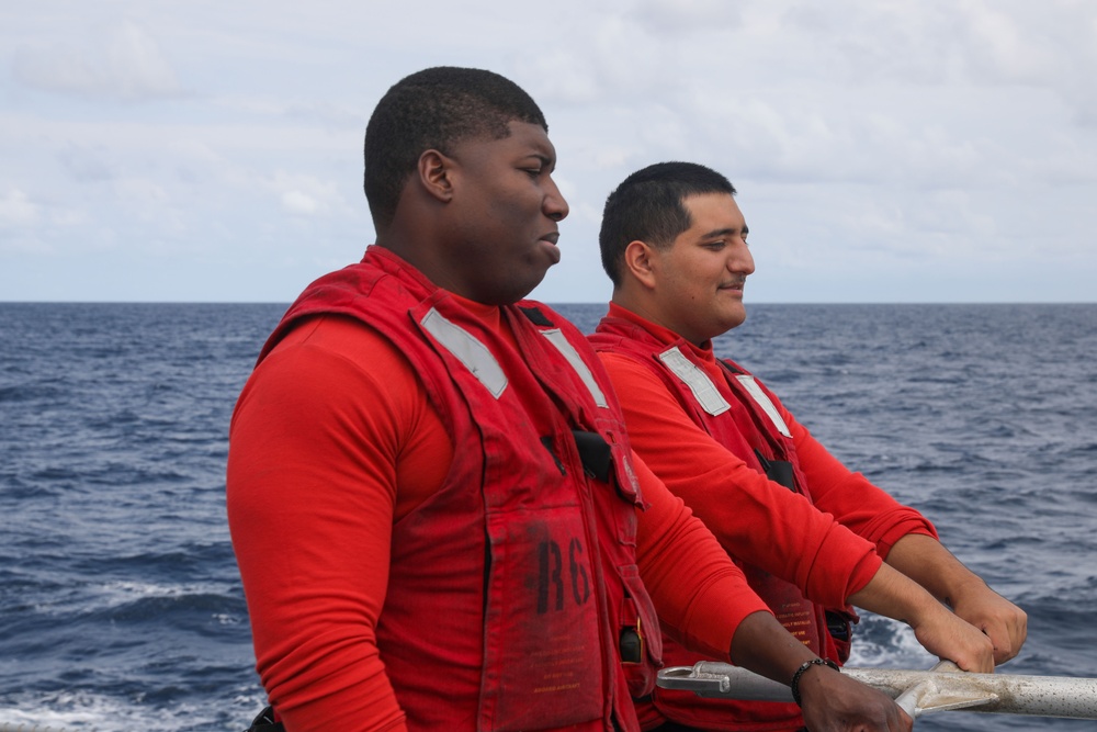 Sailors aboard the USS John Finn conduct flight quarters in the South China Sea