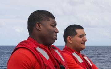 Sailors aboard the USS John Finn conduct flight quarters in the South China Sea