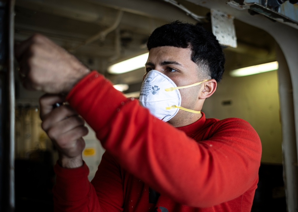 USS Gerald R. Ford (CVN 78) Sailor Conducts Maintenance