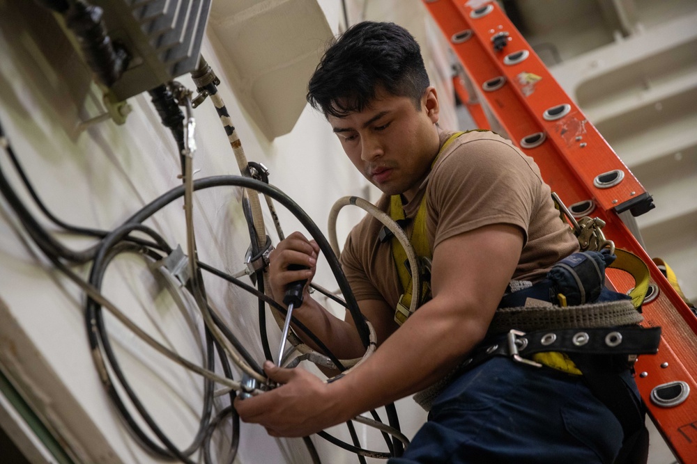USS Gerald R. Ford (CVN 78) Sailor Conducts Maintenance