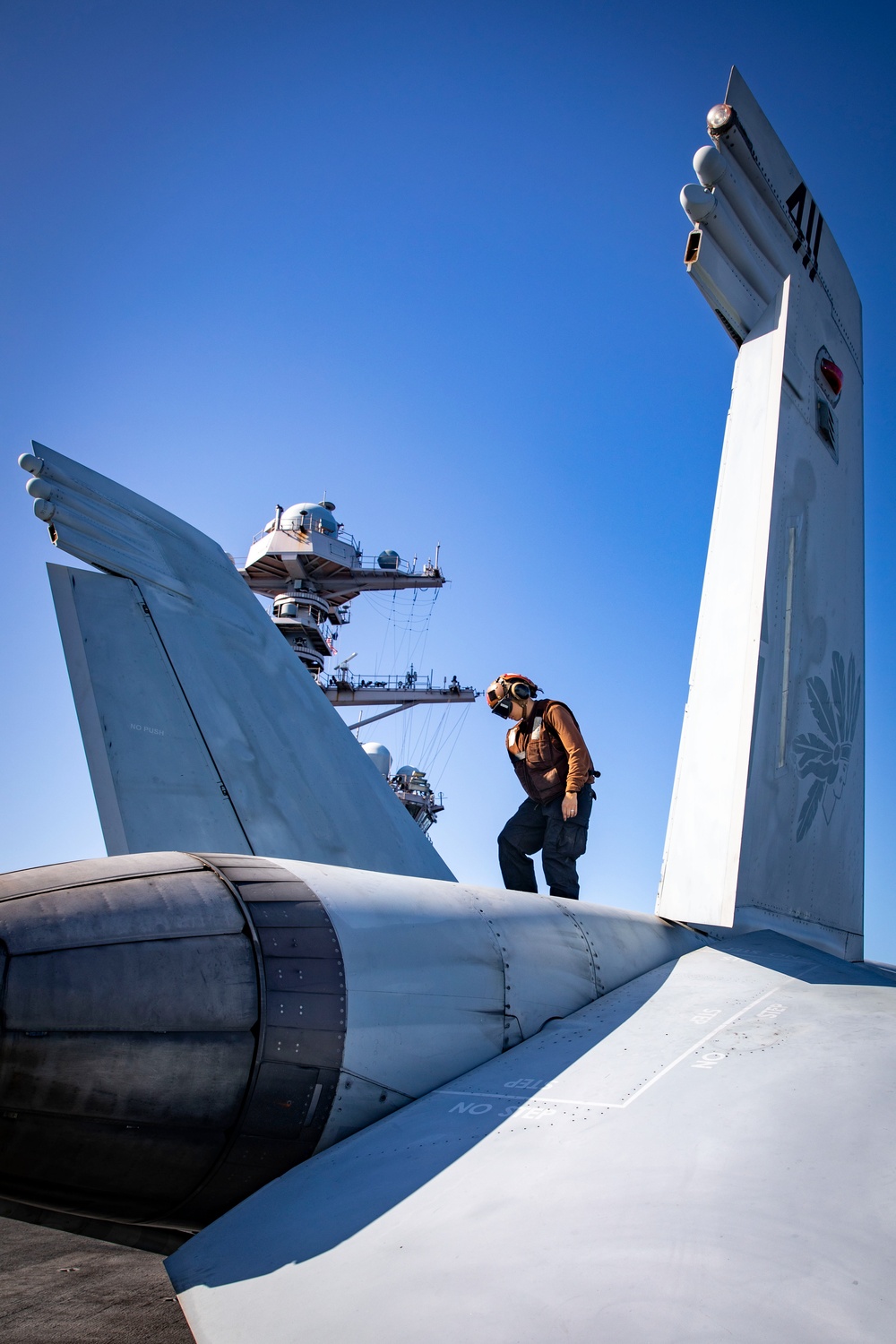 USS Gerald R. Ford (CVN 78) Sailor Inspects Jet