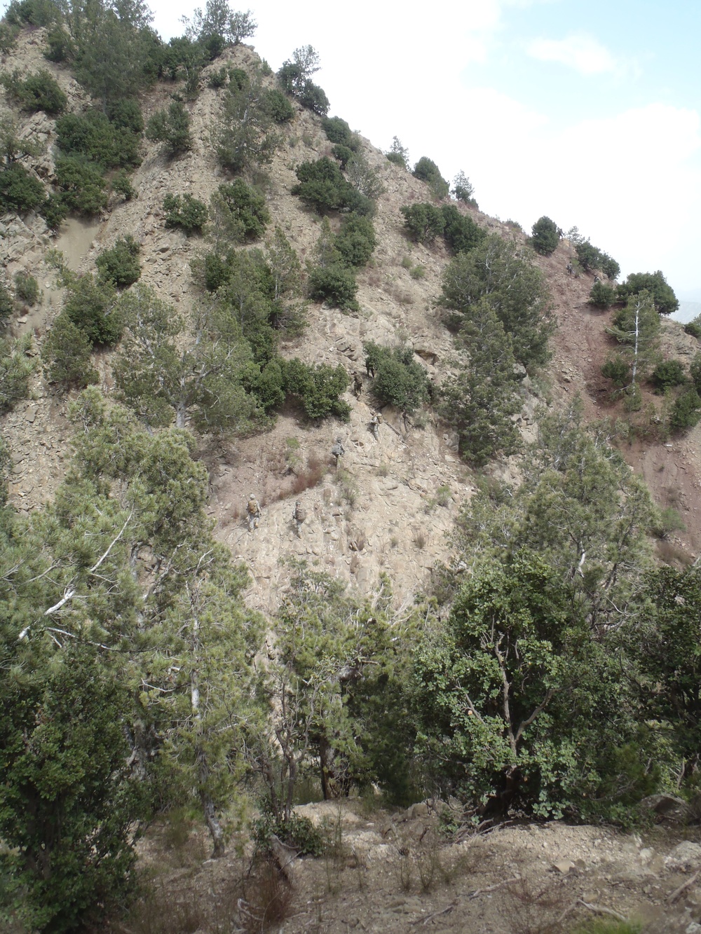 Soldiers patrol through tough terrain in East Patika Province