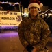 Soldier Poses for Photo during Holiday Parade
