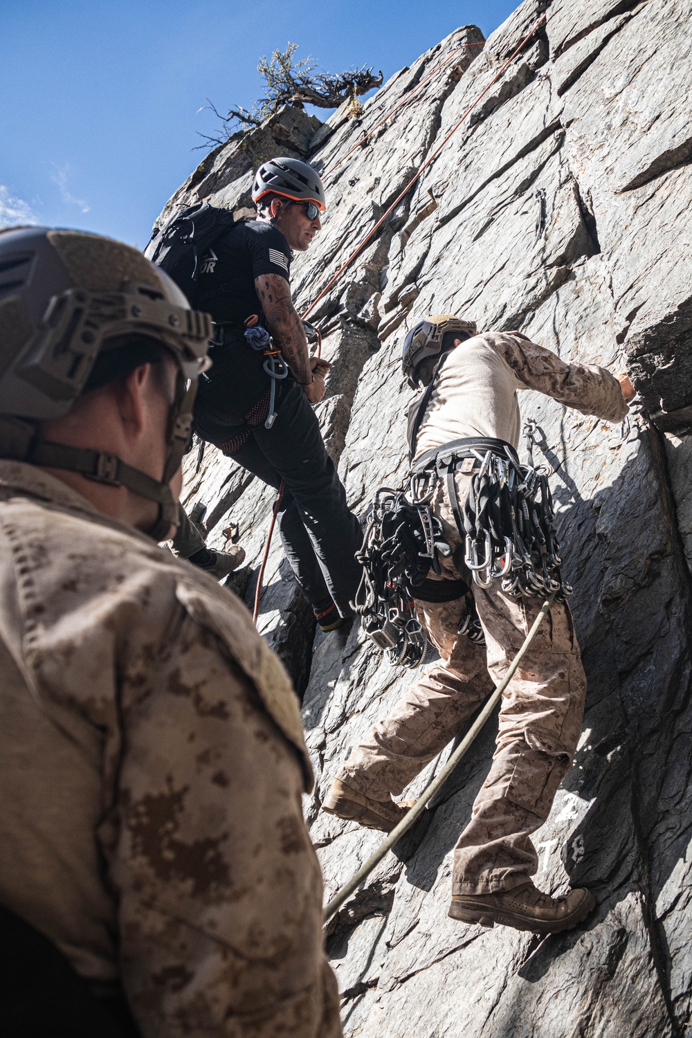 V35 and V11 Marines conduct mock lead climbing during Assault Climbers Course