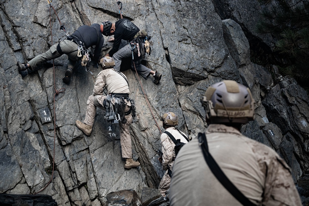 V35 and V11 Marines conduct mock lead climbing during Assault Climbers Course