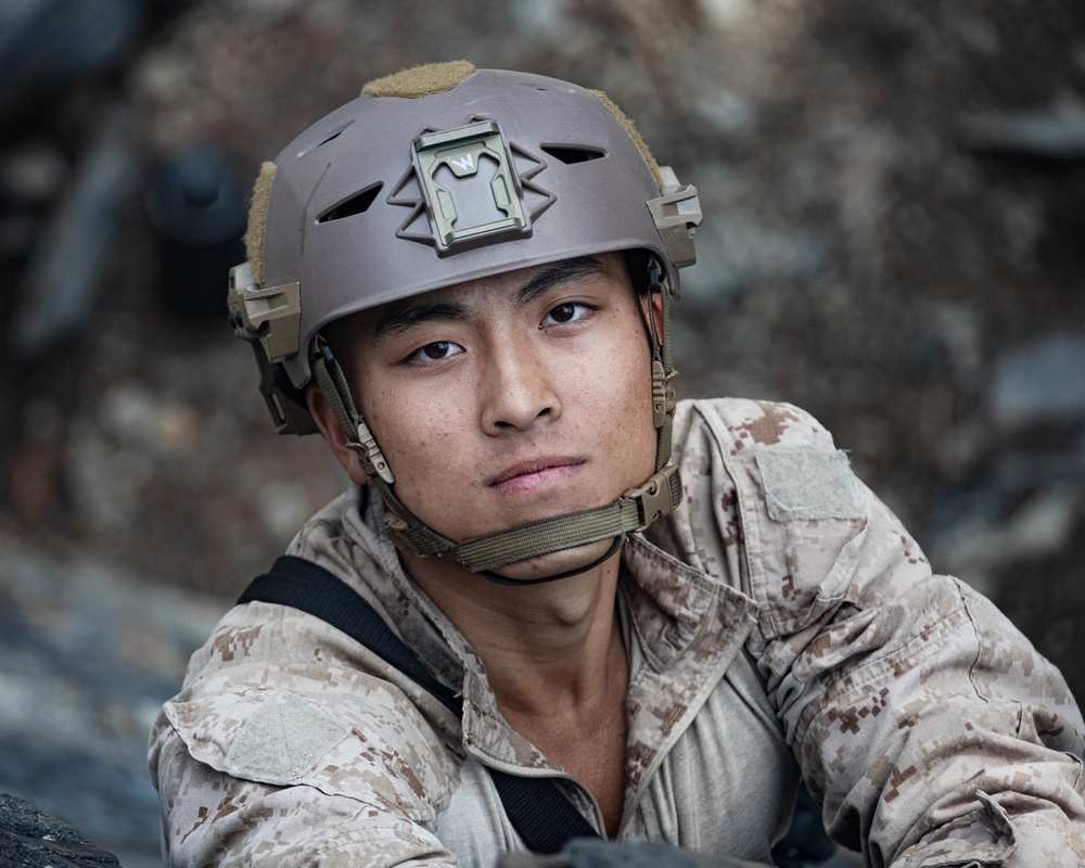 V35 and V11 Marines conduct mock lead climbing during Assault Climbers Course