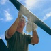 U.S. Army Soldier conducts maintenance on the rear tail blade of a UH-60 Blackhawk