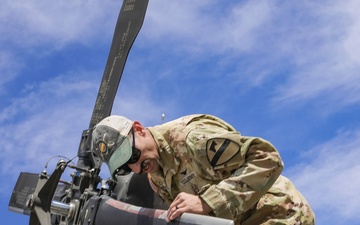 U.S. Army Soldier conducts maintenance on the rear tail blade of a UH-60 Blackhawk