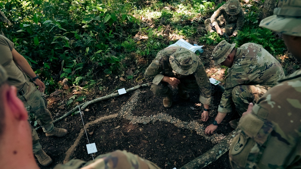U.S. Army Soldiers create a terrain model prepping for a Jungle Field Training Exercise