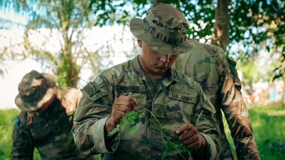 U.S. Army Soldiers create a terrain model prepping for a Jungle Field Training Exercise