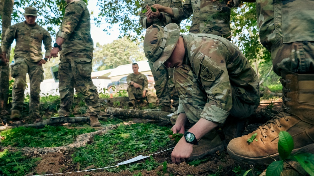 U.S. Army Soldiers create a terrain model prepping for a Jungle Field Training Exercise