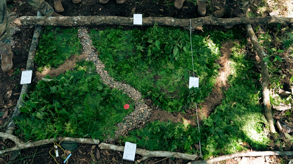 U.S. Army Soldiers create a terrain model prepping for a Jungle Field Training Exercise