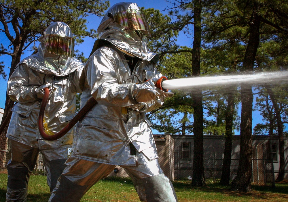 Firefighters perform hands-on proficiency training
