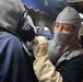 STGC Gloria Dibler assists a Sailor during a general quarters drill