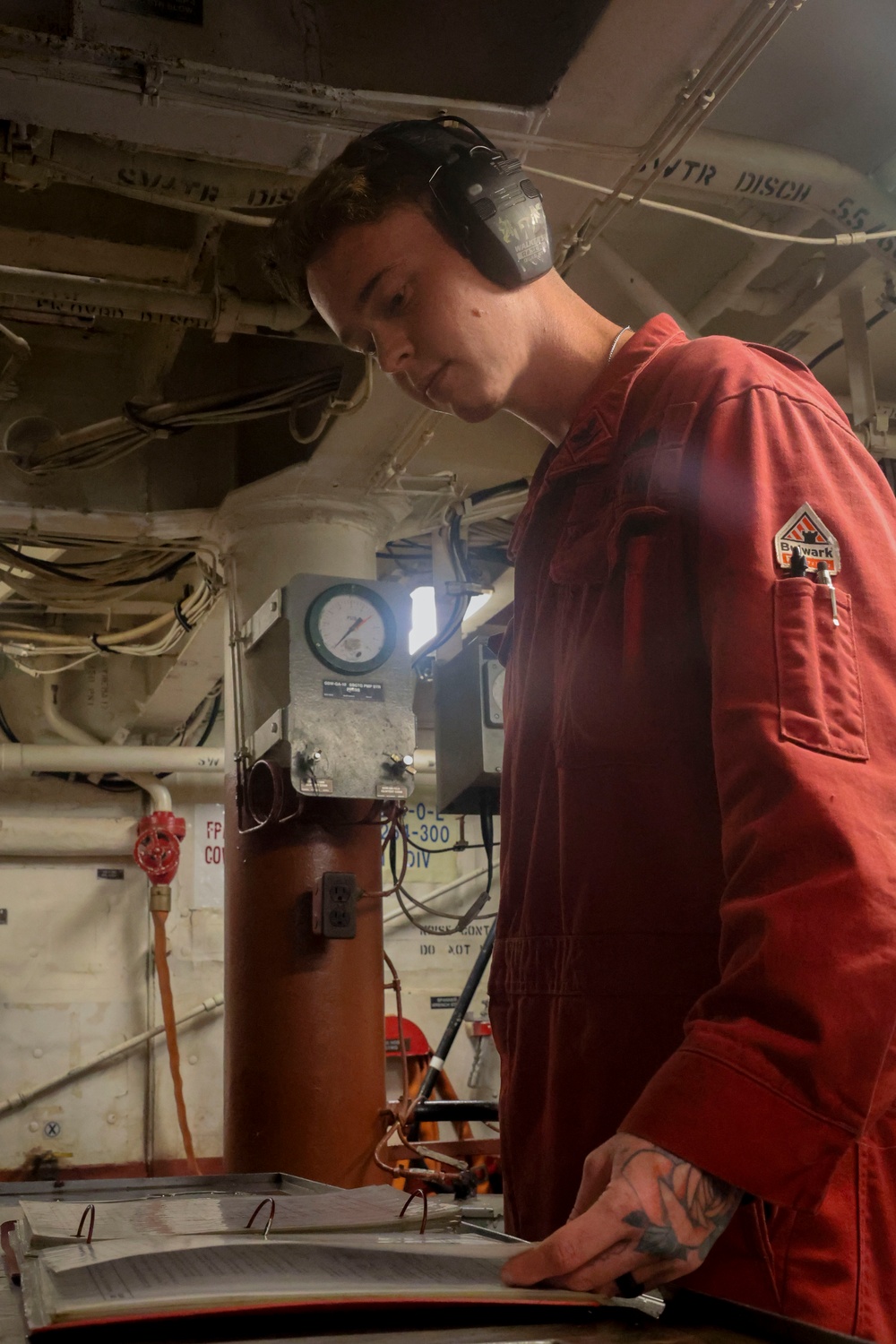 DC3 Luke Bryant reviews instructions prior to an internal fuel transfer alignment