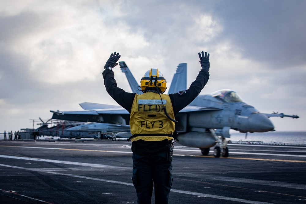 USS Gerald R. Ford (CVN 78) Sailor Signals To Aircraft