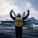USS Gerald R. Ford (CVN 78) Sailor Signals To Aircraft