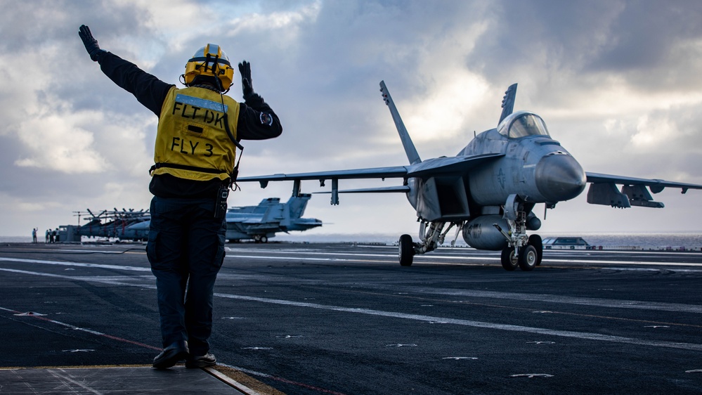 USS Gerald R. Ford (CVN 78) Sailor Signals To Aircraft