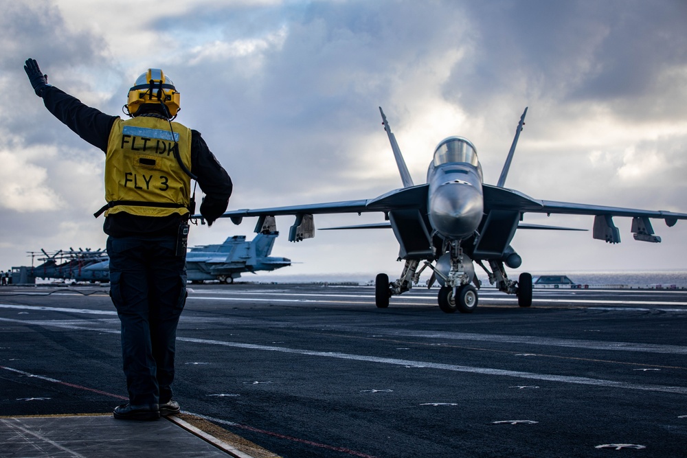 USS Gerald R. Ford (CVN 78) Sailor Signals To Aircraft