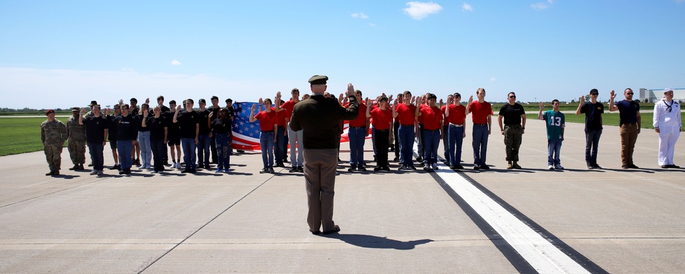 Service Begins: Enlistees sworn in during air show