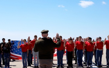 Service Begins: Enlistees sworn in during air show