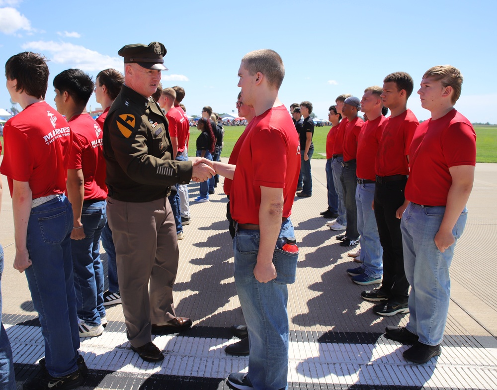 Service Begins: Enlistees sworn in during air show