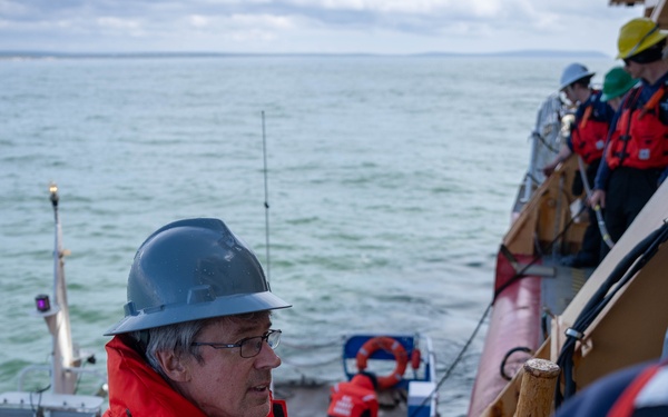 U.S. Coast Guard Cutter Healy transfers passengers offshore Nome
