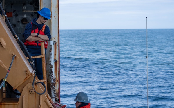 U.S. Coast Guard Cutter Healy transfers passengers offshore Nome
