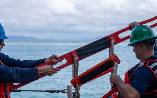 U.S. Coast Guard Cutter Healy transfers passengers offshore Nome