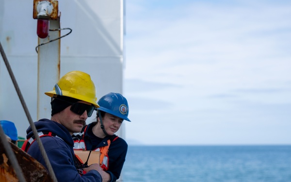 U.S. Coast Guard Cutter Healy transfers passengers offshore Nome