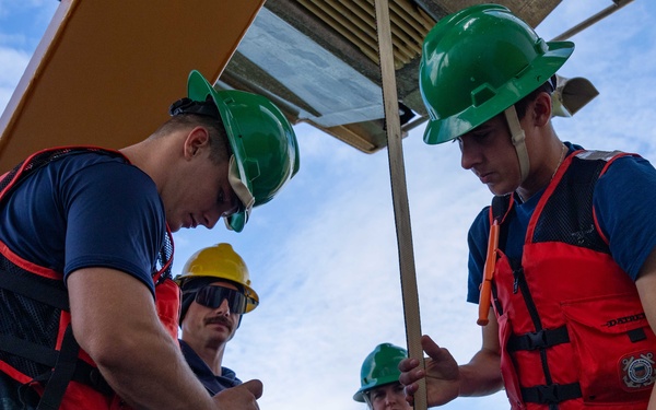 U.S. Coast Guard Cutter Healy transfers passengers offshore Nome